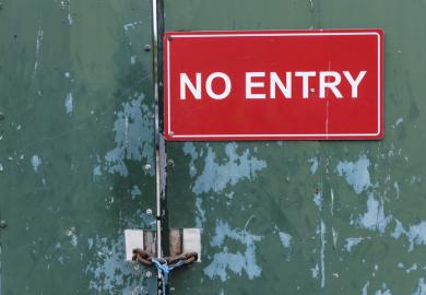 A no entry sign on a locked door illustrating visa application issues, UK Home Office, academic spouse visa
