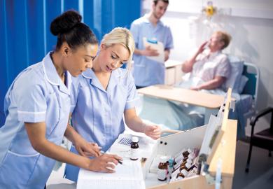 Nurses looking at chart