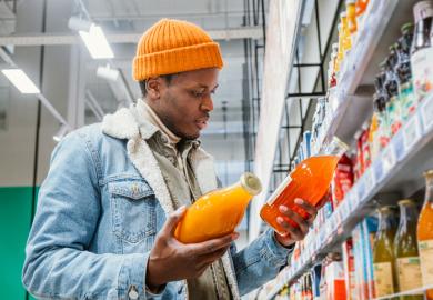 A man chooses between groceries, illustrating degree choice