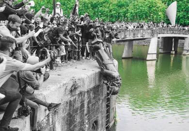 The statue of Edward Colston is pushed into the river Avon