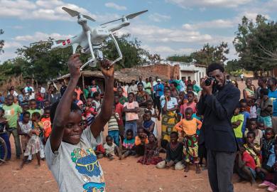 Boy holding drone