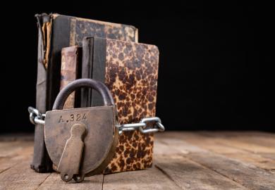 Padlocked books, symbolising restrictions on liberal arts