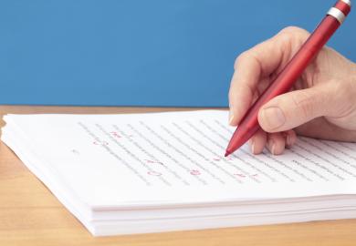 manuscript-being-corrected-red-pen