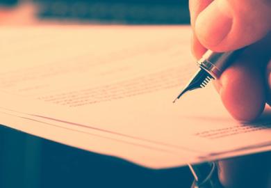 Signing a letter with a fountain pen