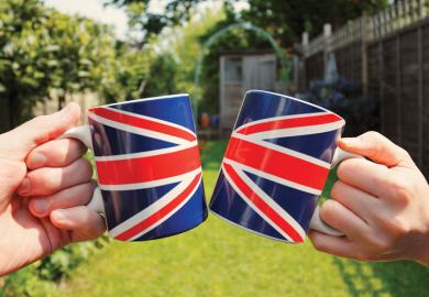 People holding Union Jack flag tea cups