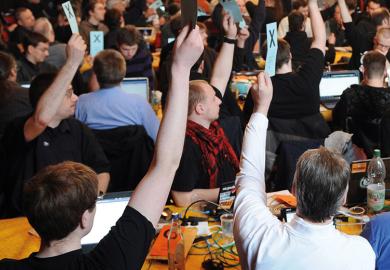A crowd of people voting