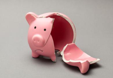 A broken piggy bank, symbolising in adequate master's loans