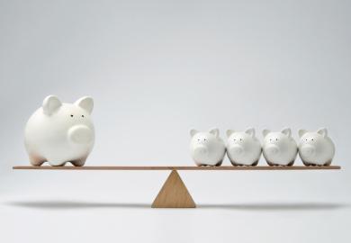 A see-saw with large and small piggy banks, symbolising levelling up