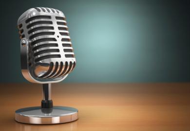 Podcast (old microphone placed on office desk)