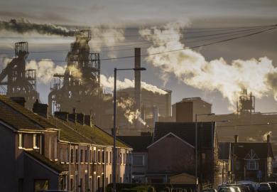 Houses in front of a steelworks in Port Talbot, symbolising local impact