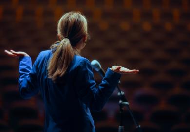 A public speaker shrugs