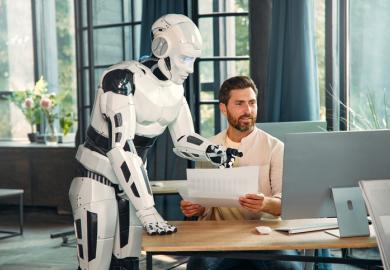 A robot helps a man write something, illustrating AI augmentation
