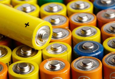 Rows of multi-coloured AA batteries