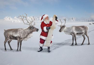 Santa checking list with reindeer
