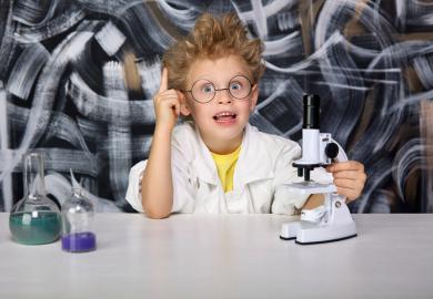 A young boy does a science experiment
