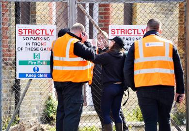Security staff try to secure the building after squatters were evicted from the University of Brighton's former Circus Street campus.