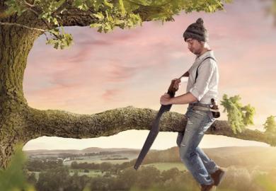 A man cutting off the tree branch he is sitting on, illustrating Home Office policy