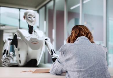 A woman writes while a robot wathes, symbolising AI tutoring