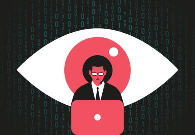 Giant eye watching at man working at the computer, symbolising spying