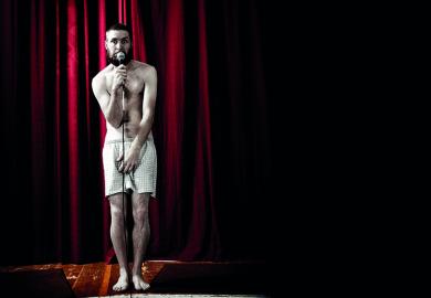 Man standing in boxer shorts on stage illustrating feature article about worst university teaching moments