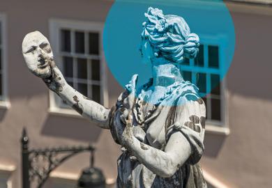 Statue contemplating mask