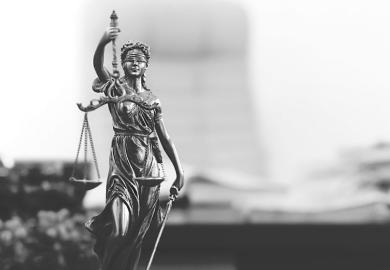 Statue of Lady Justice in academic's office