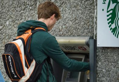 Student withdrawing money from ATM