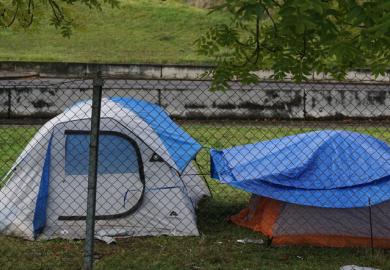 Tents behind a fence
