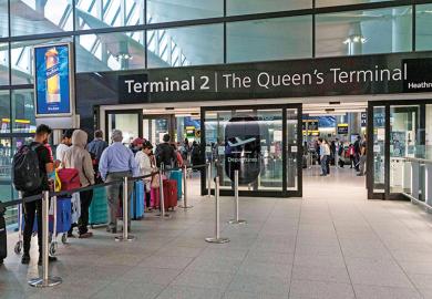People wait in line at terminal 2, Heathrow