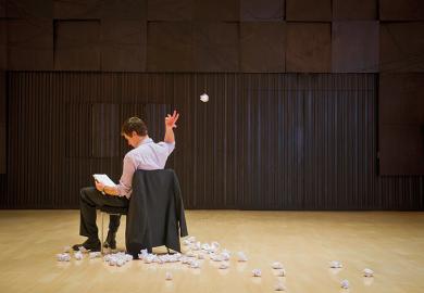 Man scrapping pieces of paper