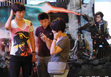 Chinese people in front of a Harry Potter backdrop