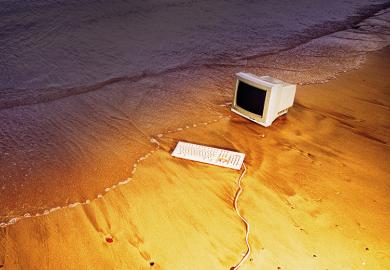 Old computer on beach