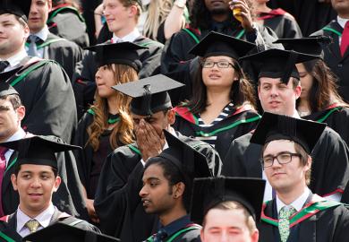 Graduating students in mortarboards