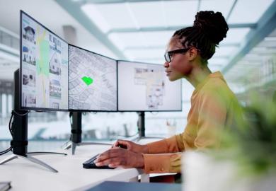 A town planner looks at her computer screen