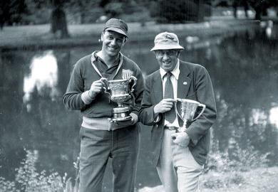 Two men with trophies