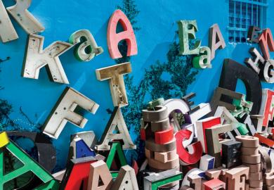 Giant letters scattered and stacked up along a building to illustrate Sloppy writing, sloppy science