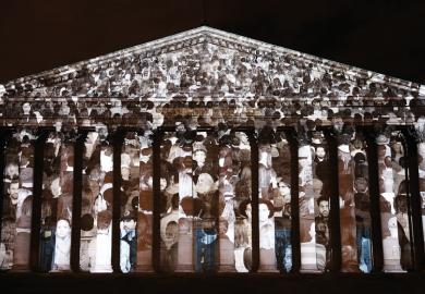 "The Standing March" a Public Artwork By Artist JR and Filmmaker Darren Aronofskyis projected on the facade of the French parliament at Assemblee Nationale to illustrate No amount of technology can replicate the magic of in-person conferences