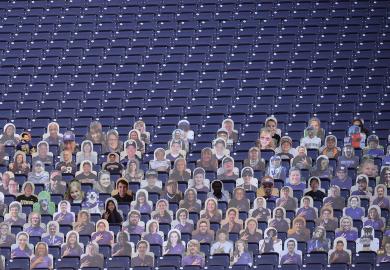 Empty stadium seats are seen with only card board cut outs of fans to illustrate The US has the scope to benefit greatly fro m overseas students