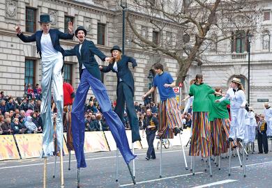 Circus taking part in London's  New Year's Day Parade, Whitehall, London England, to illustrate Who should pay to fill  fee deficit, students or the public?