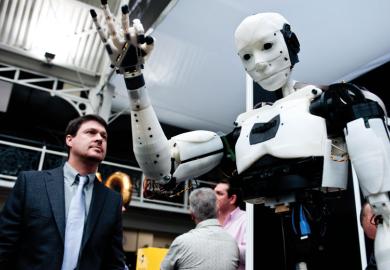 A humanoid robot on show to illustrate Funders mull robot reviewers for REF