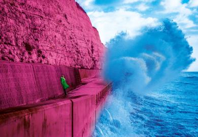 Lady watches waves crashing during stormy weather on Brighton Under cliff walk to illustrate Don’t tell me I’ll get a permanent job eventually. I probably won’t