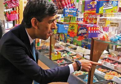 Rishi Sunak at a sweets' stand to illustrate move on from ‘sugar-rush’ policymaking