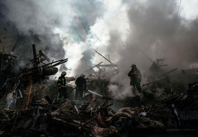 Ukrainian firefighters push out a fire after a strike in Zaporizhzhia to illustrate Pseudo science has fuelled the bloodshed in Ukraine