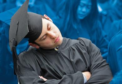 A graduate takes a snooze during his graduation ceremony as a metaphor for Pomp and monotony: why are graduation ceremonies so boring?