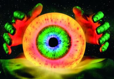 Hands out with a crystal ball with a close up of an eye image inside to illustrate the trick is to make predictions that are vague enough.