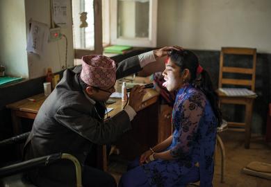 Woman getting check up at doctors