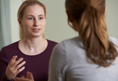 Woman speaks to counsellor