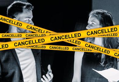 Business couple standing over illuminated desk with cancelled yellow tape in front of them to illustrate Academia’s cancel culture distracts from the right’s free-speech abuses