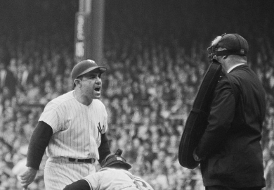 Yogi Berra bellows at the umpire in the 1962 baseball World Series, illustrating dismay at proposals to close language departments