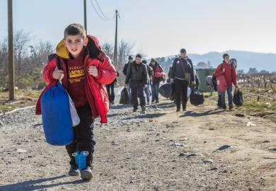 Young boy leads caravan of Syrian refugees